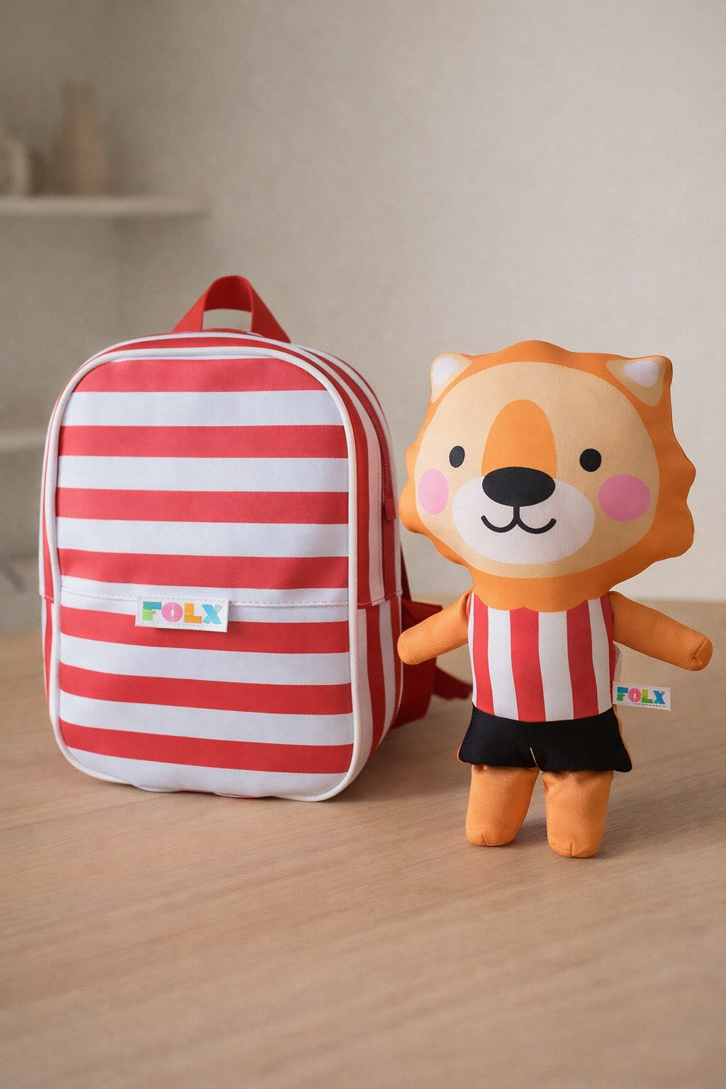 Mochila Rayas + León (Pack)